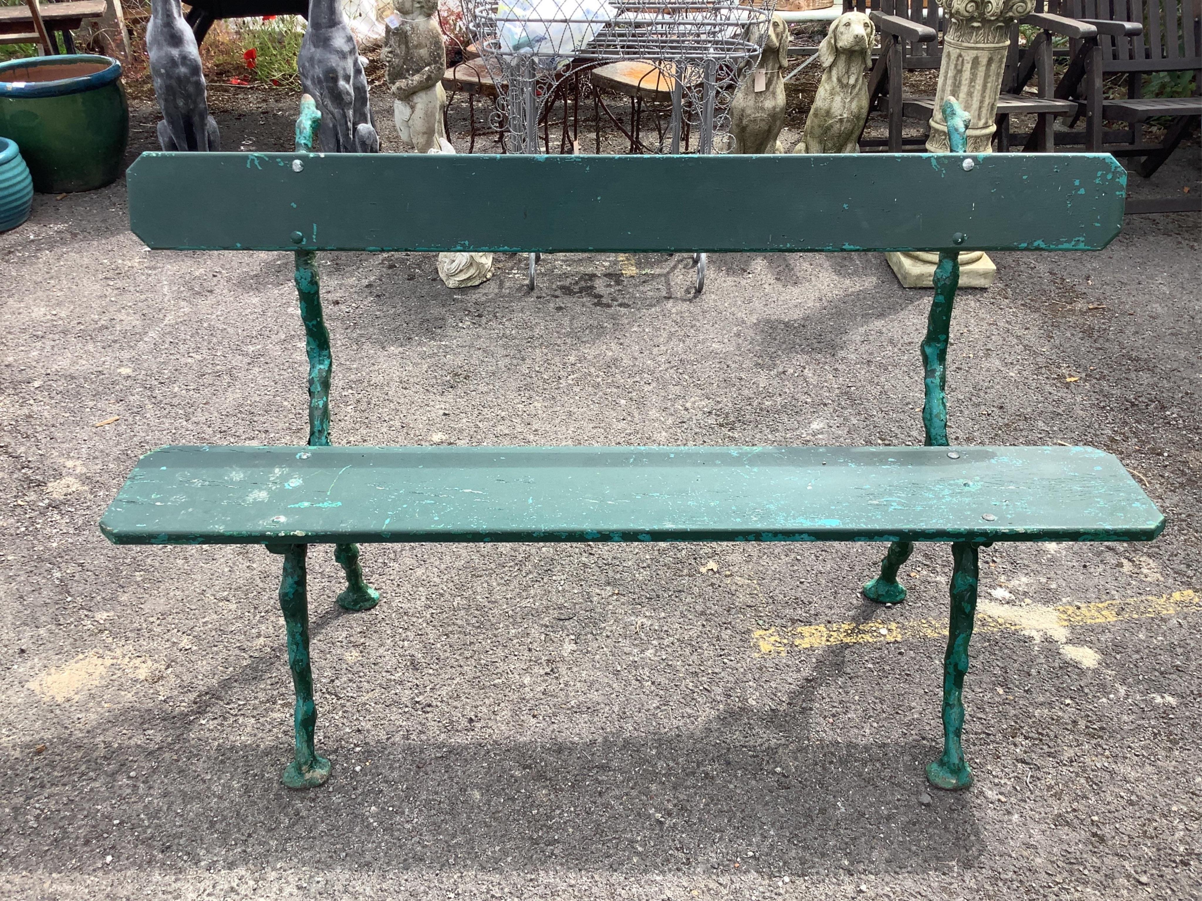 A pair of Coalbrookdale style painted cast metal garden benches, width 150cm, depth 50cm, height 91cm. Condition - fair